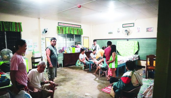 Residents of Barangay Nagdayao, Sibalom, Antique take shelter at the Nagdayao Elementary School as a precaution against flooding. PROVINCE OF ANTIQUE FACEBOOK PAGE