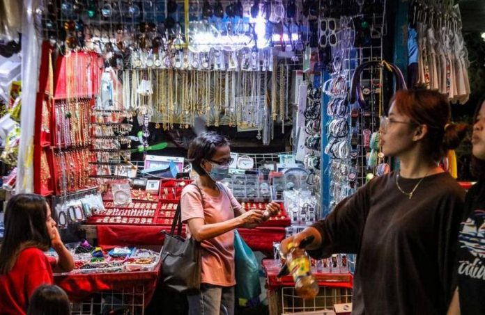 A woman buys watch straps from an accessories store at the Marikina City Public Market. JONATHAN CELLONA/ABS-CBN NEWS/FILE PHOTO