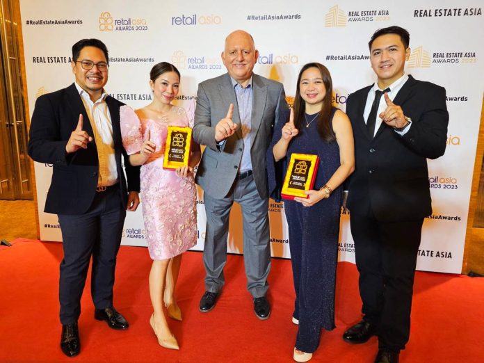 Megaworld Lifestyle Malls head Graham Coates, third from left, is joined by (L-R) Lorence Aurelio, VP and head of Leasing for Key Accounts; Karmela Jesena, Festive Walk Iloilo general manager; Tinay Magtira, AVP and head of Brand, Creatives, and Marketing; and Glenn Reyes, senior communications manager for Brand, Creatives, and Marketing in receiving the awards for the company at the Retail Asia Awards 2023 in Singapore.