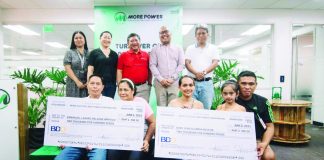 MORE Electric and Power Corporation (MORE Power) president and chief executive officer Roel Castro (standing, 3rd from left) leads the turnover of bill deposit refund to three consumers on Friday, June 2. Also in photo are (standing from left) MORE Power AVP for Customer Care Maricel Pe-Calunod, One Panay Consumer Alliance Inc. president Jane Javellana, Energy Regulatory Commission commissioner Alexis Lumbatan, and Grupo Konsumidor president Atty. Eldrid Antiquiera; and (sitting from left) consumers Emmanual Emprogo and wife and Baby Jean Agustin and family.