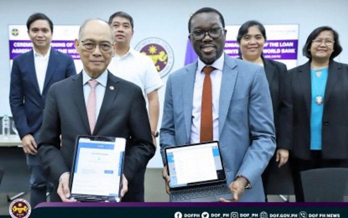 Finance Secretary Benjamin Diokno (left) and World Bank Country Director for the PH Ndiamé Diop sign four loan agreements on Monday, June 26. The agreements amounting to USD1.14 billion will support economic recovery, agriculture, education, and sustainability. DOF PHOTO