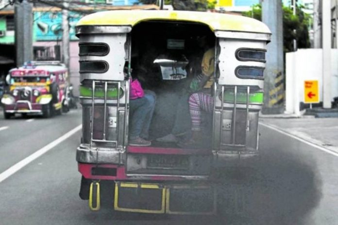 A jeepney smoke belches along J.P. Rizal St., Makati City. INQUIRER FILE PHOTO / RAFFY LERMA