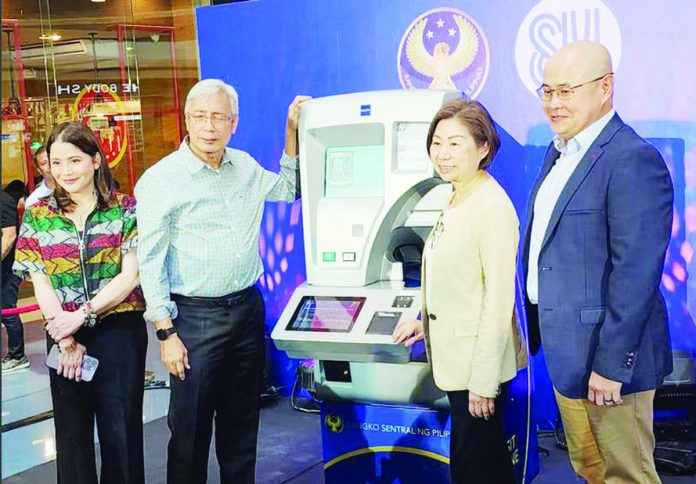 Bangko Sentral ng Pilipinas (BSP) Governor Felipe Medalla, BSP Deputy Governor Bernadette Romulo-Puyat, and SM Investments Corp. Vice Chairperson Teresita T. Sy-Coson launch the BSP's Coin Deposit Machines. HANDOUT PHOTO