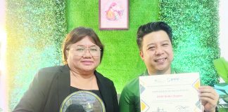 Program manager Mona Liza S. Diones (left) and chapter board president Atty. Jon Cerlan Bangoy celebrate Family Planning Organization of the Philippines - Iloilo’s top performance rating award for 2022.