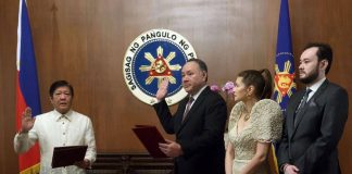 Newly appointed Defense Secretary Gilbert "Gibo" Teodoro takes oath of office with President Marcos. PPA Pool