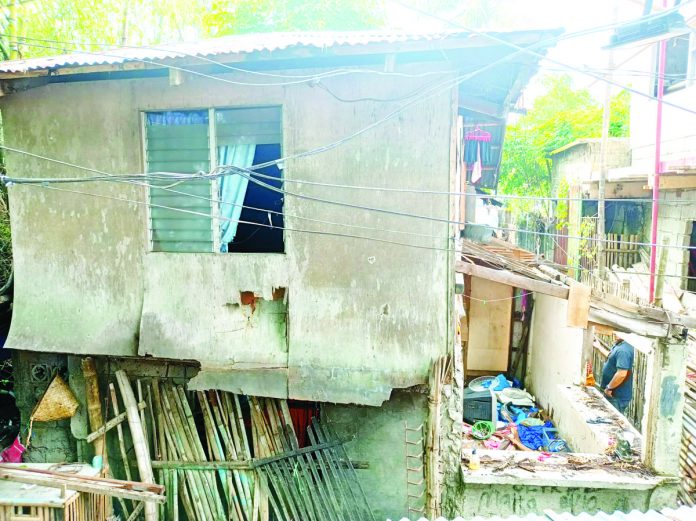 The house (right) of Melba Jeminillo (left) and her family in Barangay Bakhaw, Mandurriao, Iloilo City was destroyed by 10 unidentified armed men on Tuesday night, June 20. Barangay Captain Joel Alvarado said the armed men were allegedly looking for someone else and may have attacked the wrong house. AJ PALCULLO/PN