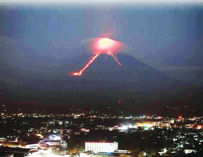 Lava flows from Mayon volcano as seen in Legazpi City, Albay. Mayon, a near-perfect cone that also draws thousands of tourists during its periods of quiet, rises 2,460 meters above Legazpi. AFP