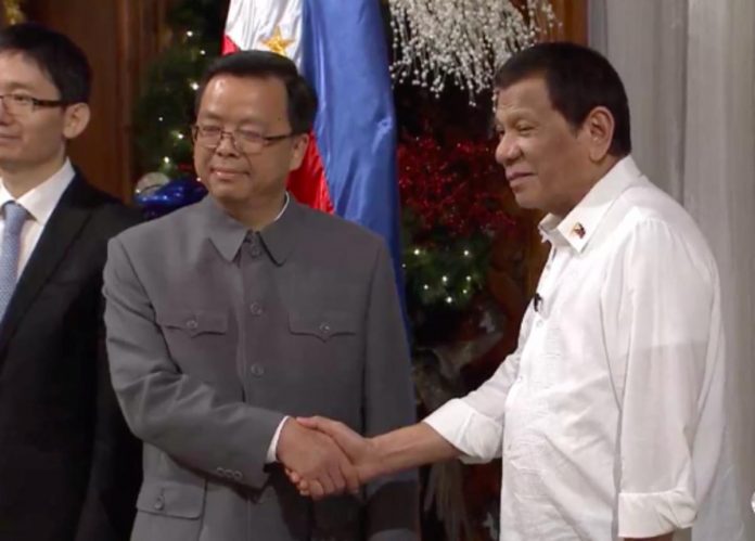 This file photo taken on Dec. 4, 2019, shows then-President Rodrigo Duterte welcoming the newly-appointed Chinese ambassador to the Philippines, Huang Xilian, in Malacañan. PHOTO FROM THE FACEBOOK PAGE OF RTVM