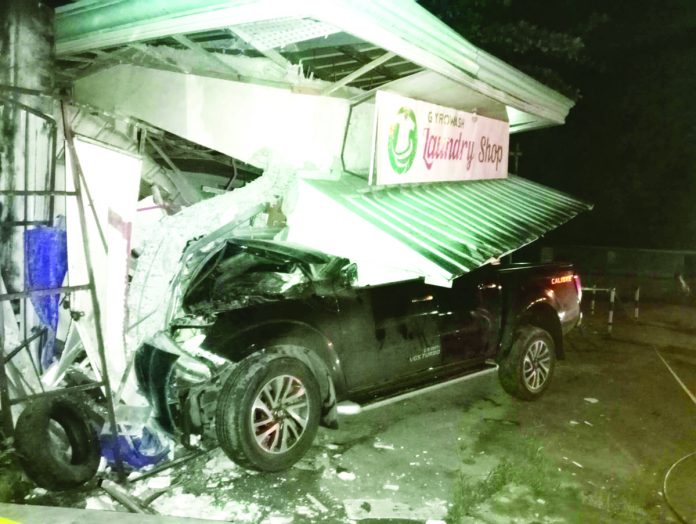 A pickup truck driver left with only minor injuries after he overshot the road and crashed into a laundry shop in Mandurriao, Iloilo City on Thursday, June 22. RADYO BANDERA ILOILO PHOTO