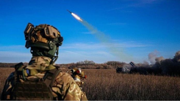 A Ukrainian soldier watches a rocket launcher firing towards Russian positions on the front line in eastern Ukraine. GETTY IMAGES