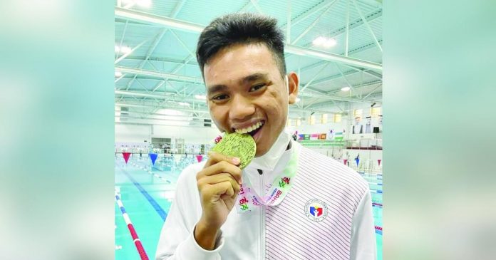 Medalist Ariel Joseph Alegarbes served as Team Philippines’ flag-bearer during the opening ceremony of the 12th ASEAN Para Games in Cambodia. PHOTO COURTESY OF PHILSPADA