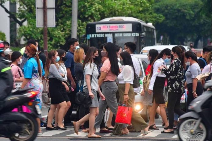 Pedestrians walk at a crossing in Makati City. The number of unemployed persons aged 15 years old and above declined to 2.26 million in April 2023, according to the Philippine Statistics Authority. MARK DEMAYO/ABS-CBN NEWS PHOTO