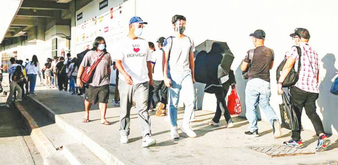 Passengers flock to the Parañaque Integrated Terminal Exchange to catch buses headed to southern Luzon provinces. Latest Labor Force Survey results showed proportion of unpaid work in the country is increasing. GEORGE CALVELO, ABS-CBN NEWS/FILE PHOTO