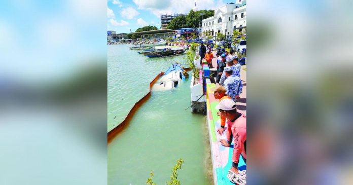 The sunken patrol boat of the Bureau of Fisheries and Aquatic Resources-6 was retrieved yesterday morning, July 4. AJ PALCULLO/PN