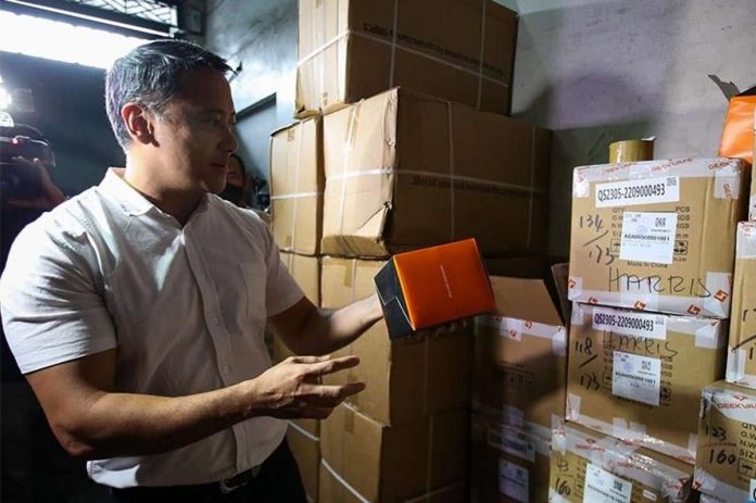 Bureau of Internal Revenue (BIR) commissioner Romeo Lumagui Jr. says the bureau recently confiscated several bottles of alcohol and boxes of cigarettes with no excise tax stamp in Makati City. Photo shows then-BIR deputy commissioner Lumagui in a raid of a warehouse of alleged illegal vapes in Tondo, Manila in 2022. THE STAR/JESSE BUSTOS PHOTO