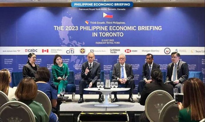 Finance Secretary Benjamin Diokno (sitting, 3rd from left) says Canada may benefit from the recent liberalization of the Philippines’ renewable energy sector. DEPARTMENT OF FINANCE/HANDOUT PHOTO