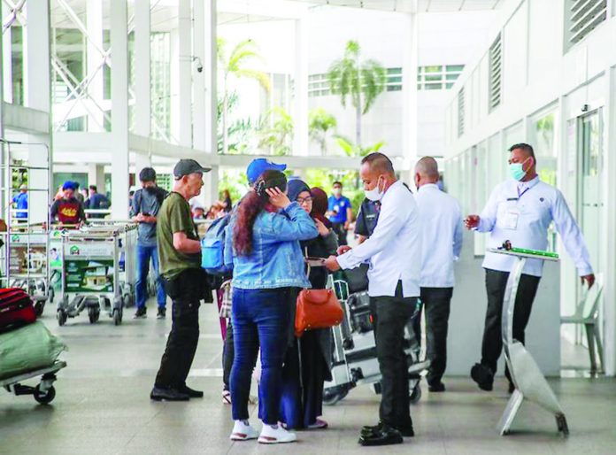 Travelers arrive at the Ninoy Aquino International Airport Terminal 2 in Pasay City. JONATHAN CELLONA/ABS-CBN NEWS PHOTO