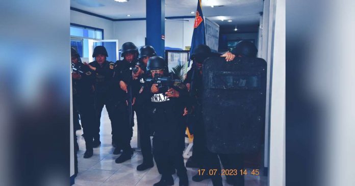 The Roxas City Police Station conducts simulation exercises during a field evaluation and validation for the Best Component City Police Station-National Level award of the Philippine National Police. ROXASCITY PNP PCADS FB PHOTO