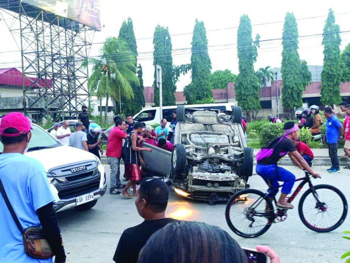 A Honda City Sedan overturned after hitting a vehicle and the center island in Barangay Ungka, Pavia, Iloilo on Friday, July 7. RADYO BANDERA ILOILO PHOTO