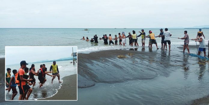 Personnel of the Guimbal Municipal Police Station and Bureau of Fire Protection, rescue teams and residents joined hands in rescuing eight family members who drowned at a beach resort in Guimbal, Iloilo on Wednesday, July 5. Six survived while two minors died. AJ PALCULLO/PN