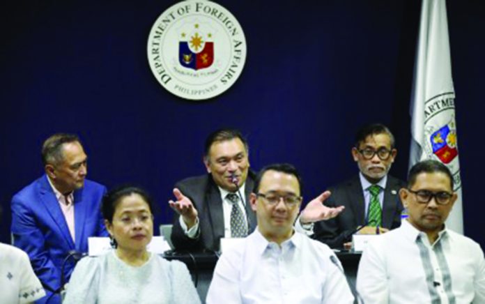 Department of Foreign Affairs (DA) undersecretary for Civilian Security and Consular Affairs Jesus Domingo (center, back row) discusses the e-Visa for foreign nationals during a press conference at the DFA central office along Roxas Boulevard in Pasay City on Wednesday, July 5. He said the Philippines will launch the e-Visa system for foreign travelers within the third quarter of 2023. PNA PHOTO BY AVITO DALAN