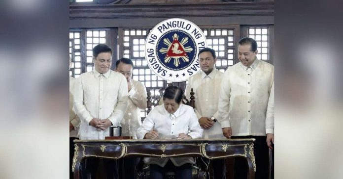 President Ferdinand Marcos Jr. signs the Maharlika Investment Fund bill into law on Tuesday, July 18, 2023. PHOTO FROM RTV MALACAÑANG