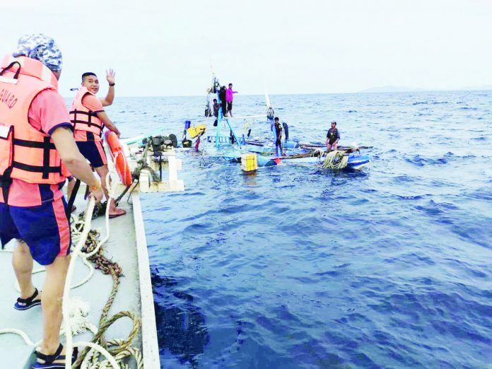 Seven crew members of a distressed fishing boat in the seawater between Masbate and Carles, Iloilo were rescued on Friday, July 28. PCG ILOILO STATION