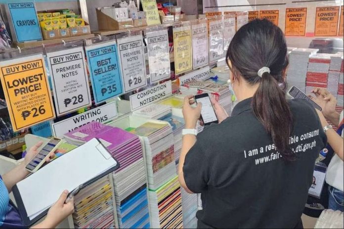 Department of Trade and Industry officials inspect a store selling school supplies in Marikina City. JEKKI PASCUAL/ABS-CBN NEWS PHOTO