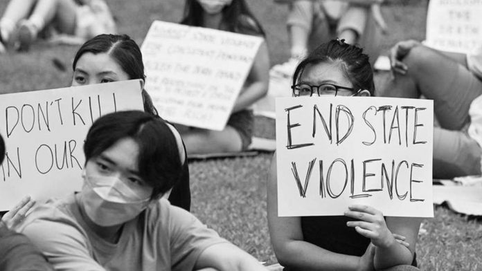 Singaporeans attend an anti-death penalty protest in Singapore. GETTY IMAGES