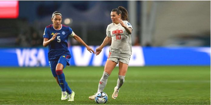 Hali Long of Philippines and Ramona Bachmann of Switzerland chase the ball during their 2023 FIFA Women’'s World Cup game. AFP PHOTO