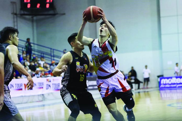 Nico Paolo Javelona of San Miguel Beermen evades the defense of his fellow Bacolodnon player Kib Montalbo of TNT Tropang Giga for a shot attempt. PBA PHOTO