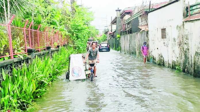 The Iloilo Provincial Health Office advises the public to avoid wading in floodwater to avoid getting infected with bacterial disease, especially if one has an open wound on the foot. AJ PALCULLO/PN