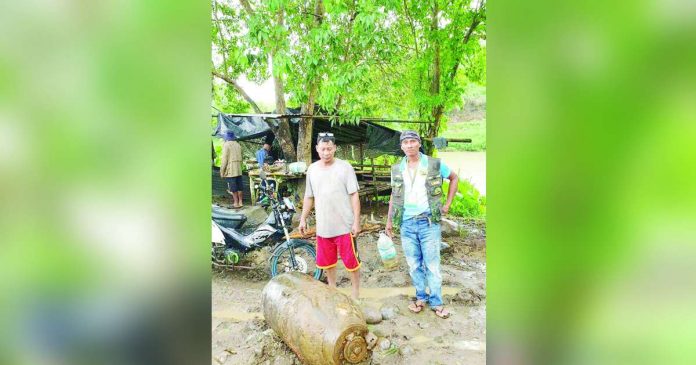 A vintage bomb, believed to be from World War II, was unearthed in Cadiz City, Negros Occidental on Monday, July 24. FERRER FACEBOOK PHOTO
