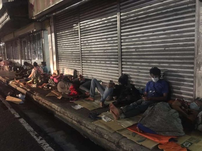 Patient watchers sleep on cardboards outside the Corazon Locsin Montelibano Memorial Regional Hospital in Bacolod City, Negros Occidental. AKSYON RADYO BACOLOD PHOTO