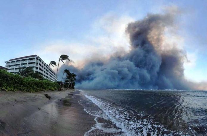 Smoke billows as wildfires destroy a large part of the historic town of Lahaina in Maui, Hawaii. REUTERS