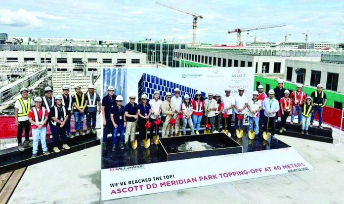 This is the topping-off of ASCOTT-DD Meridian Park building conducted by DoubleDragon, Asya Design, Megawide, and DCI on Aug. 22, 2023 in Pasay City. ASCOTT-DD Meridian Park, with over 300 luxury serviced residences located right behind DoubleDragon Plaza, is expected to be operational and begin to generate recurring revenues by 2024.