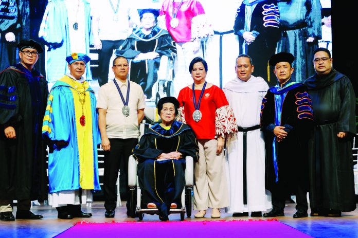 Dr. Olivia Villaflores Yanson (seated) was conferred an Honorary Degree of Doctor of Philosophy in Business Management by the University of Negros Occidental Recoletos (UNO-R) Bacolod on Aug. 30, 2023. With her were her son Leo Rey Yanson (3rd from left) and daughter Ginette Yanson Dumancas (5th from left). Also present during the conferment were UNO-R Bacolod president Rev. Fr. Joel Alve, OAR (2nd from left); Dr. Dennis Madrigal (leftmost), dean of the Recoletos de Bacolod Graduate School; Rev. Fr. Romeo Ben Potencio, Jr., OAR, (3rd from right) Vice President for Academics and Research; Commission on Higher Education Region 6 director Raul Alvarez (2nd from right); and Rev. Fr. Rafael B. Pecson (rightmost), OAR Councilor and President of the Recoletos Educational Apostolate in the Philippines and Vice Chair of UNO-R Inc. Board of Trustees.