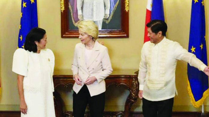 President Ferdinand Marcos Jr. (right) gestures while European Commission President Ursula von der Leyen (center) talks to First Lady Marie Louise Araneta Marcos during her visit at Malacañang Presidential Palace in Manila on Monday, July 31. The two leaders are expected to hold bilateral meetings to bolster European Union-Philippines relations and discuss matters on trade, security and global challenges in infrastructure. AARON FAVILA, AFP/POOL PHOTO