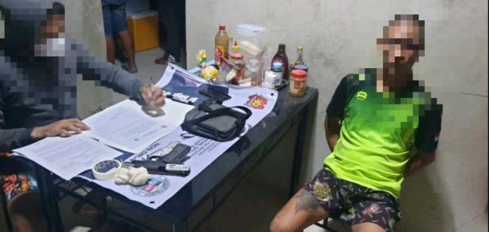 Drug suspect Roel Cerbolles was arrested through a search warrant in Barangay Canabajan, Calinog, Iloilo on Monday, Aug. 7. He yielded P315,000 worth of suspected shabu, caliber .45 pistol and fragmentation grenade. IPPO PHOTO