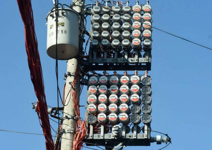 Electrical meters with countless electrical wires are seen hanging near residences in Barangay Addition Hills, Mandaluyong City. GEORGE CALVELO, ABS-CBN NEWS/FILE PHOTO