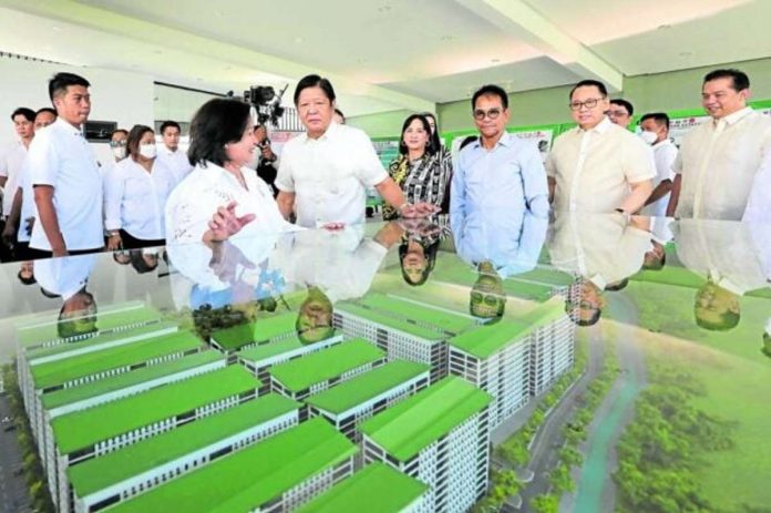 SHELTER PROJECT. President Ferdinand Marcos Jr. and other government officials inspect a scale model for a government housing project in the City of San Fernando, Pampanga. PNA