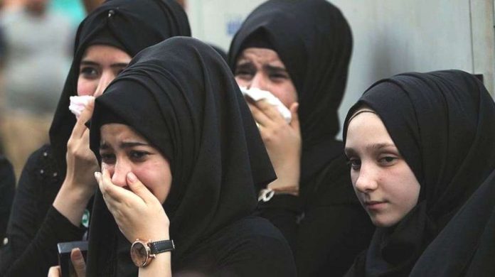 Iraqi women mourn at the site of the 2016 bombing in Baghdad’s Karrada district during a symbolic funeral for the victims of the attack. AFP