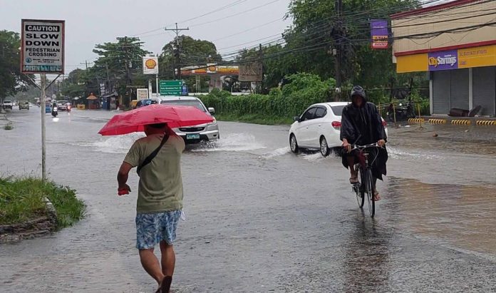 Floodwaters cover this portion of the National Highway in Leganes, Iloilo.