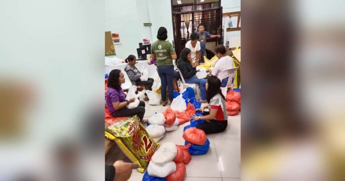 Provincial Social Welfare and Development Office personnel prepare family food packs for displaced families in Antique. PROVINCE OF ANTIQUE PHOTO