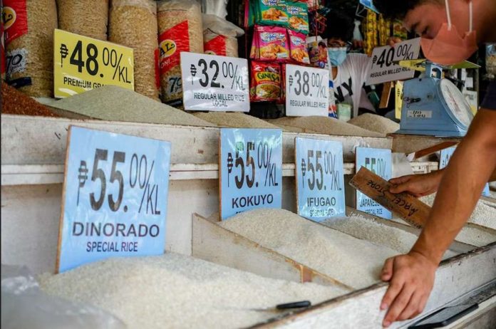 A market vendor waits for customers in front of their store inside a public market in Quezon City. GEORGE CALVELO, ABS-CBN NEWS/FILE PHOTO