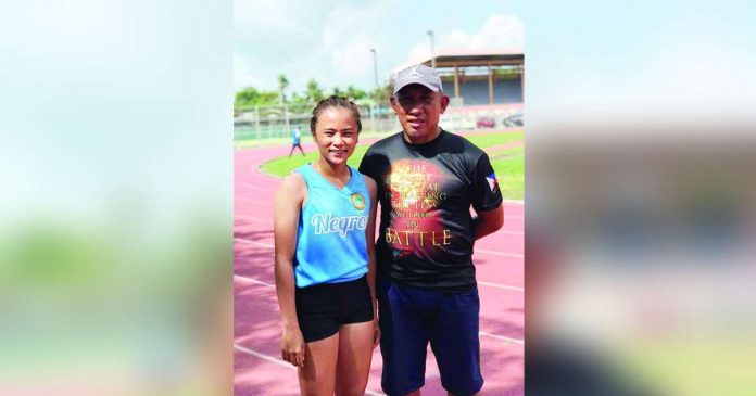 Negrense jumper Bianca Juliana Seroy with head coach Amado Juguan. CONTRIBUTED PHOTO