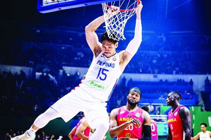 Gilas Pilipinas’ June Mar Fajardo scores on an uncontested two-handed dunk during their 2023 FIBA World Cup game against Angola. FIBA PHOTO