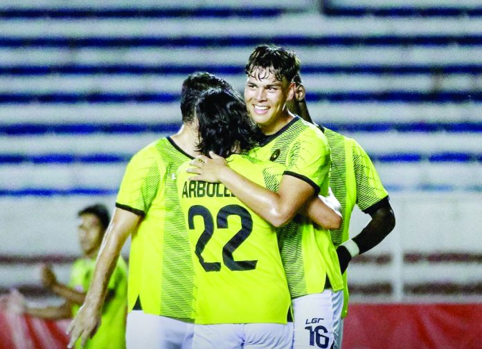 Kaya-Iloilo FC newcomer Justin Baas (16) is hugged by teammate Fitch Arboleda after knocking in a goal early in the second half against Loyola FC. KAYA-ILOILO PHOTO