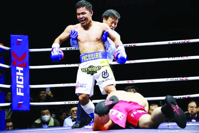 Retired Filipino boxer Manny Pacquiao knocks down South Korean Youtuber DK Yoo during their exhibition match last December 2022. PHOTO COURTESY OF WENDELL ALINEA/MP PROMOTIONS