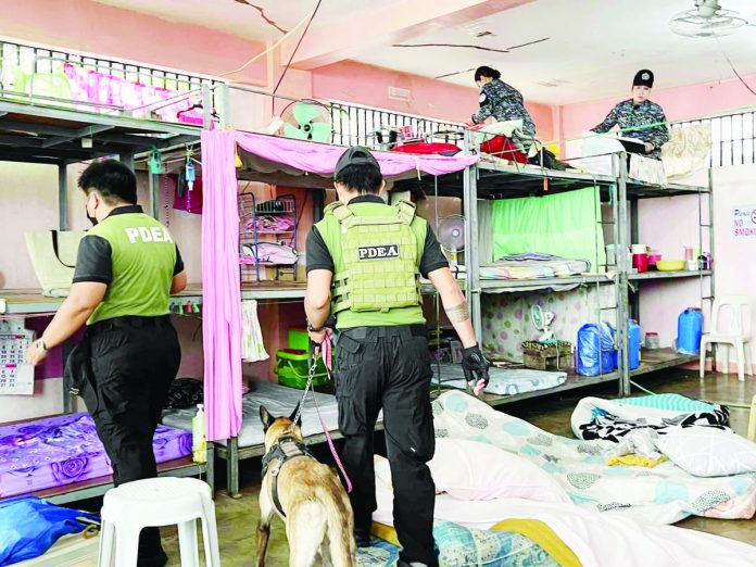 Personnel of the Philippine Drug Enforcement Agency conduct a greyhound operation and drug test at the Aklan District Jail in Kalibo. PDEA REGION VI